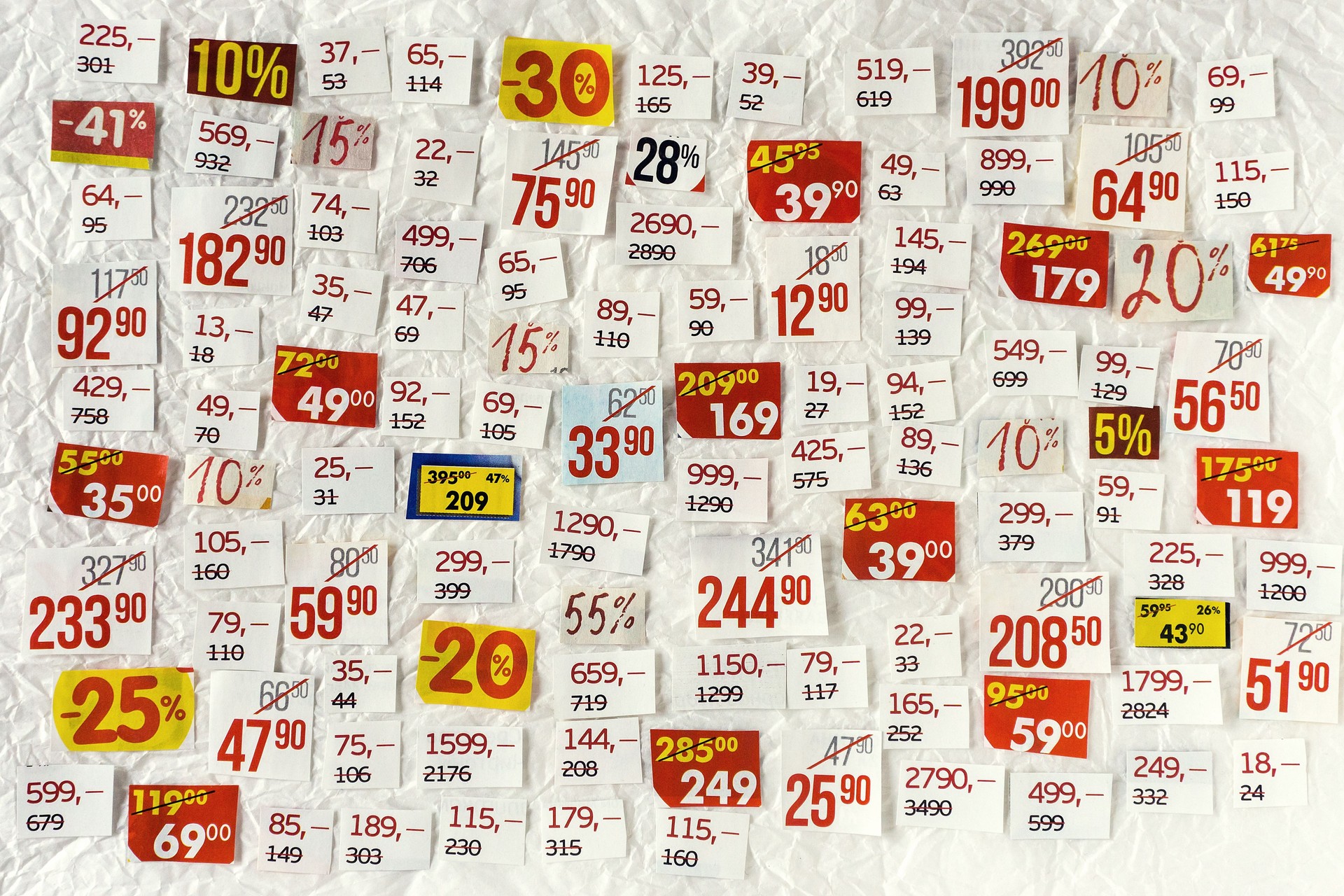 DISCOUNTS background of cut paper figures.